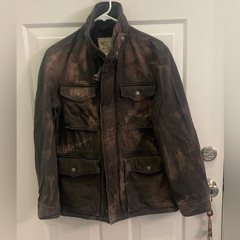 American Eagle jacket, size S. Camo style with pockets and patches on back.